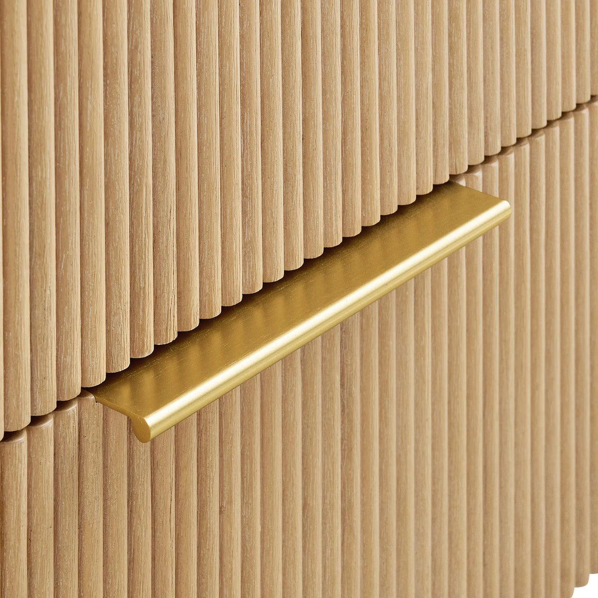 Handle detail: brushed gold pull set into the ribbed Washed Ash Grey drawer face