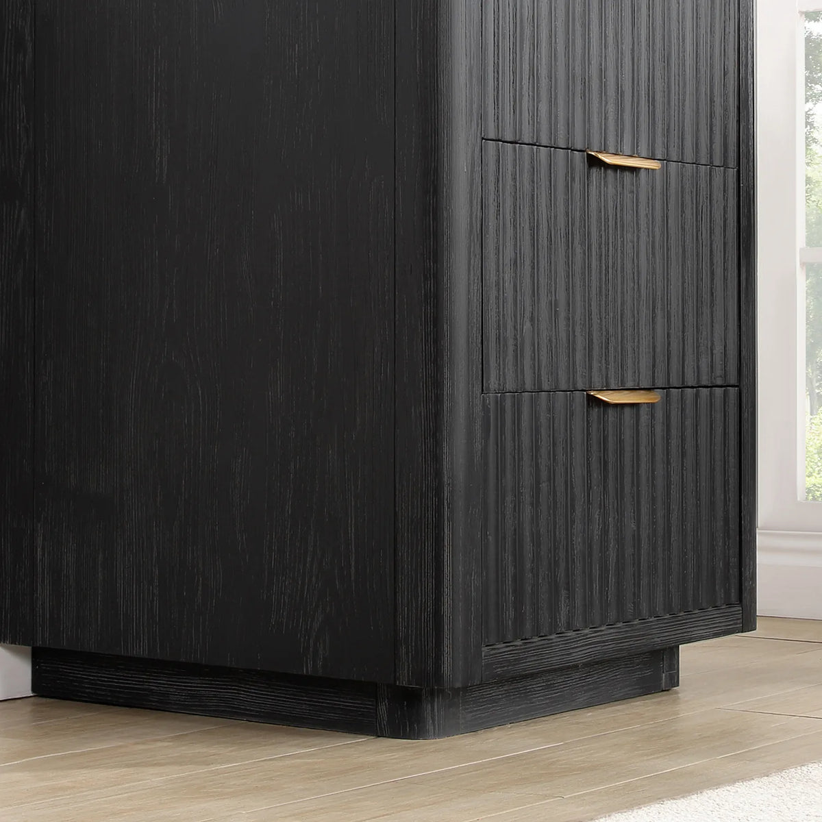 Detail of the fluted cabinet side, slim pulls and plinth base on the Fir Wood Black vanity