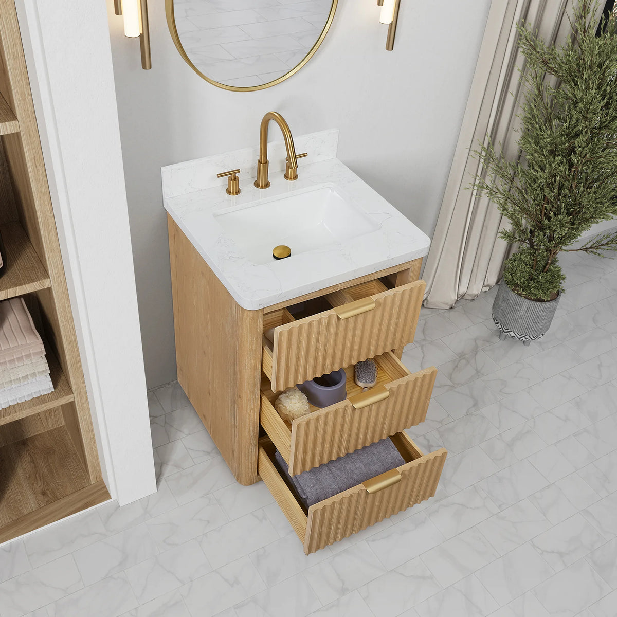Pulled-open drawers on the 24 inch vanity, the undermount sink sitting in the top above