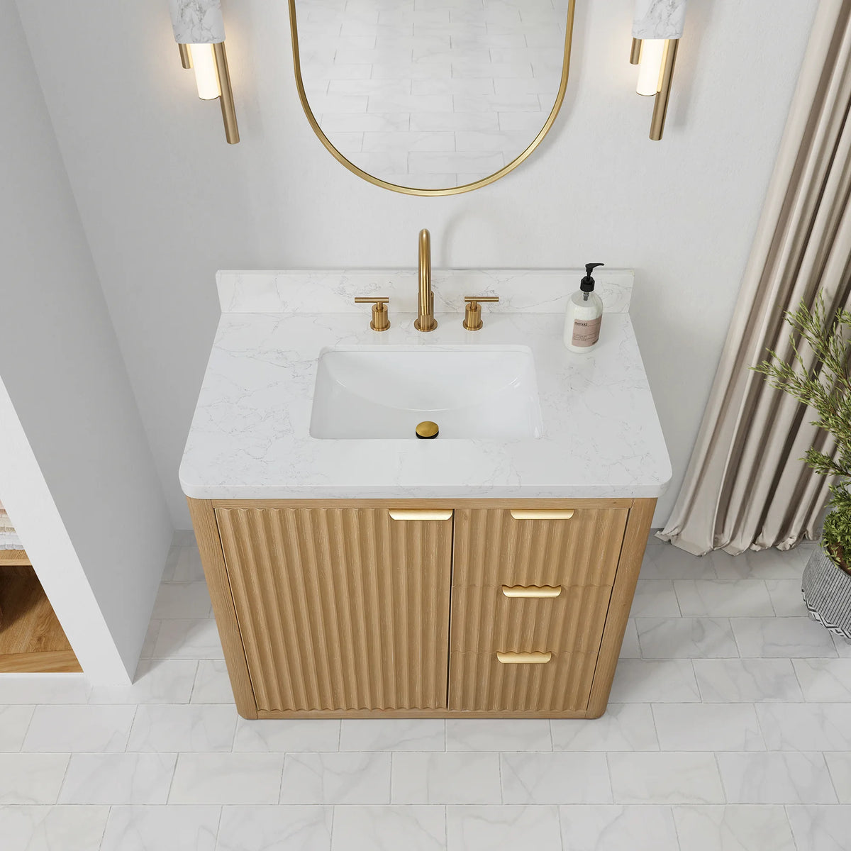 High-angle view of the 36 inch vanity top and white ceramic undermount sink, door and drawer fronts below