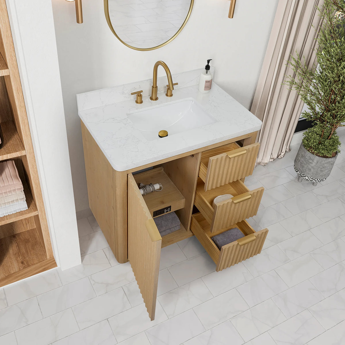 Opened door and pulled-out drawers on the 36 inch vanity, with the undermount sink in the top