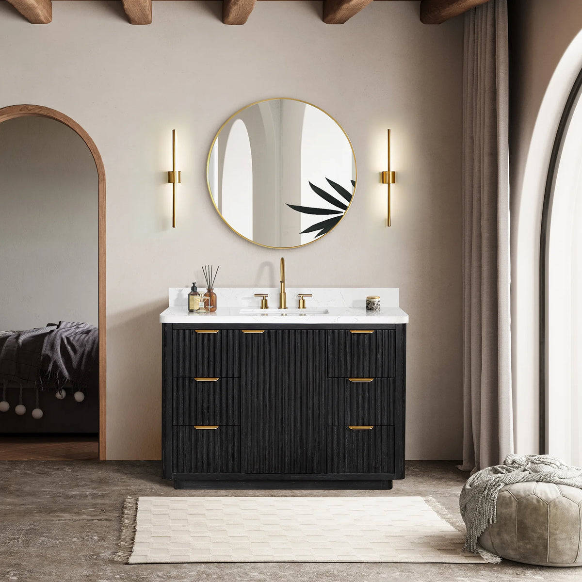 Styled room: 48 inch Fir Wood Black vanity under a circular mirror with sconces, a rug and a pouf