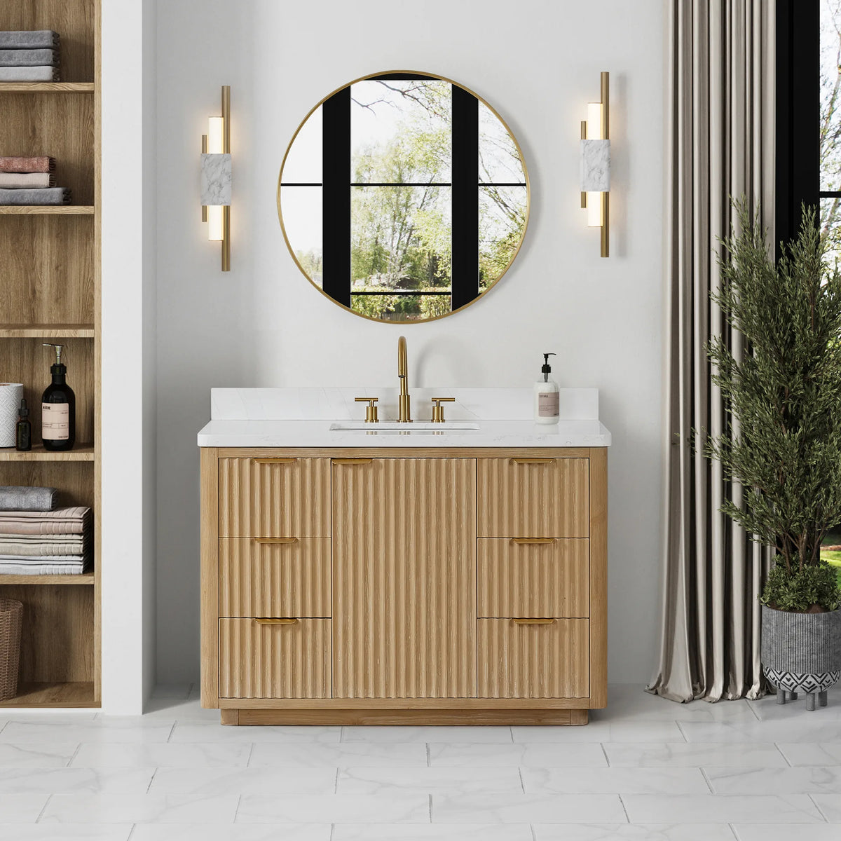 48 inch wood vanity in a bright bathroom with a circular mirror, shelf unit and potted plant