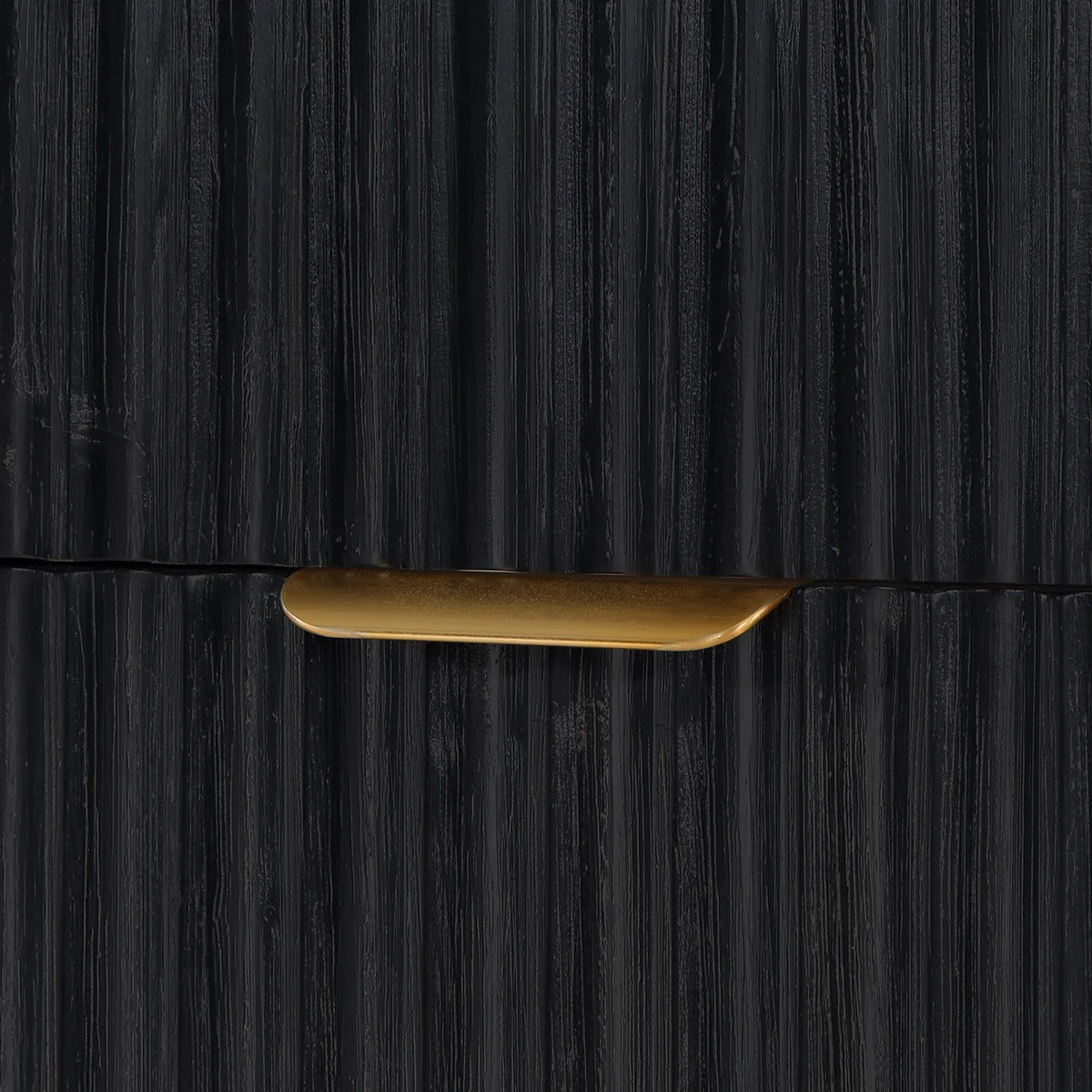 Close-up of a slim curved pull between two fluted drawer fronts in Fir Wood Black